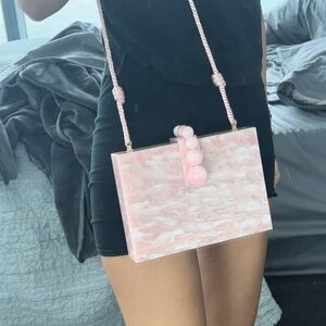 Cult Gaia acrylic pink bag with a strap or can be a clutch
NWT AND BOX